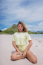 Modest cropped swim top from NAYA – swimwear layering piece with sleeves for Muslim women, stylish and sun-safe.