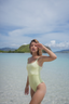 NAYA modest one-piece swimsuit in honeydew and melon – UV sun protection swimwear with elegant modest fashion cut.