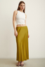 Side profile of the modest Satin Flared Skirt in Olive in movement.